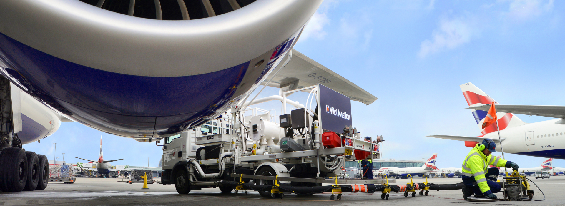 Man in hi-vis jacket refuelling aeroplane