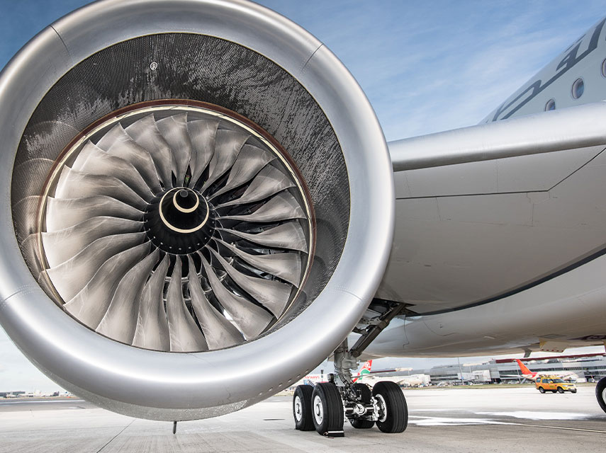 jet plane wing and engine turbine on airport runway